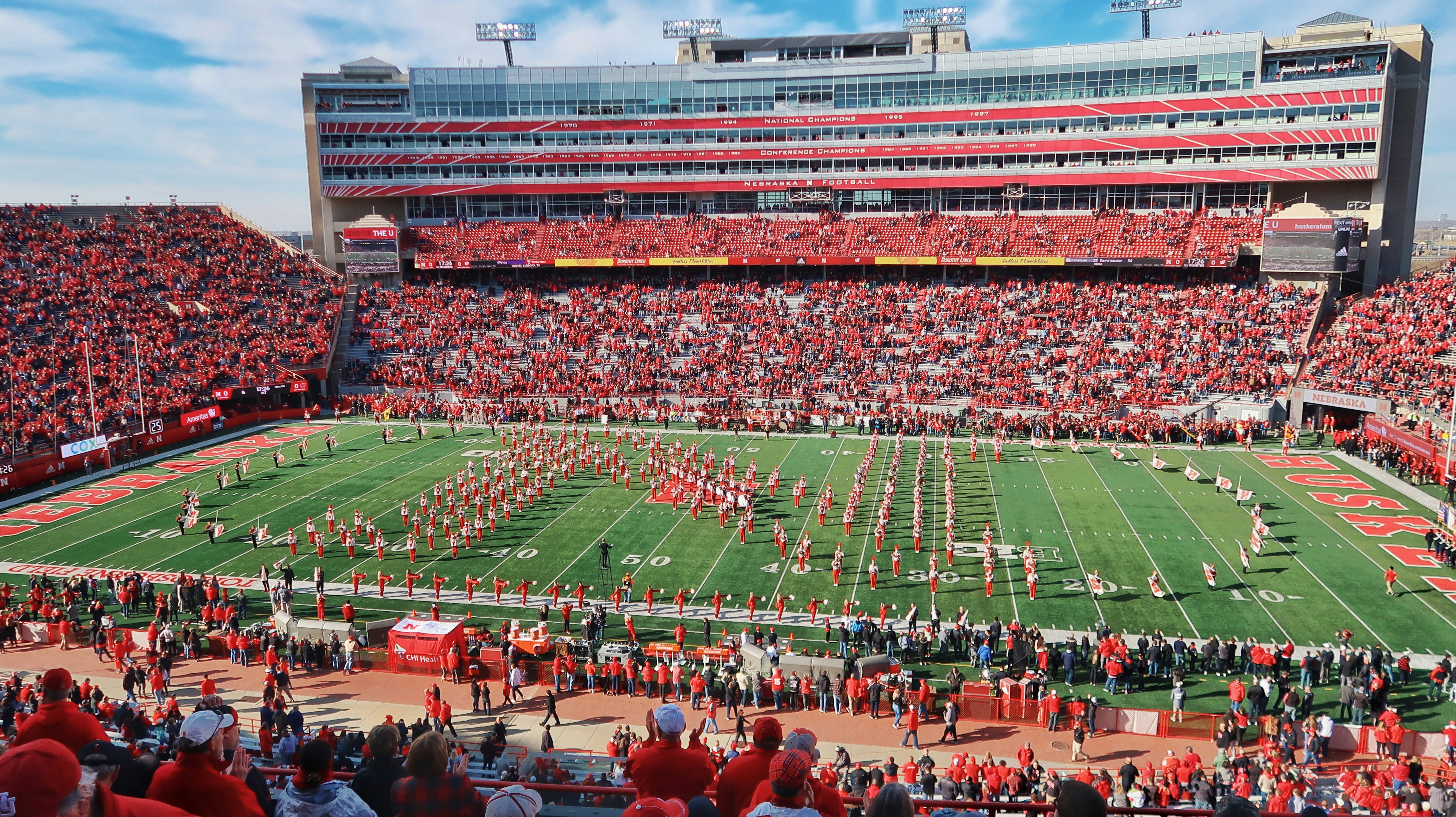 people on football stadium during daytime